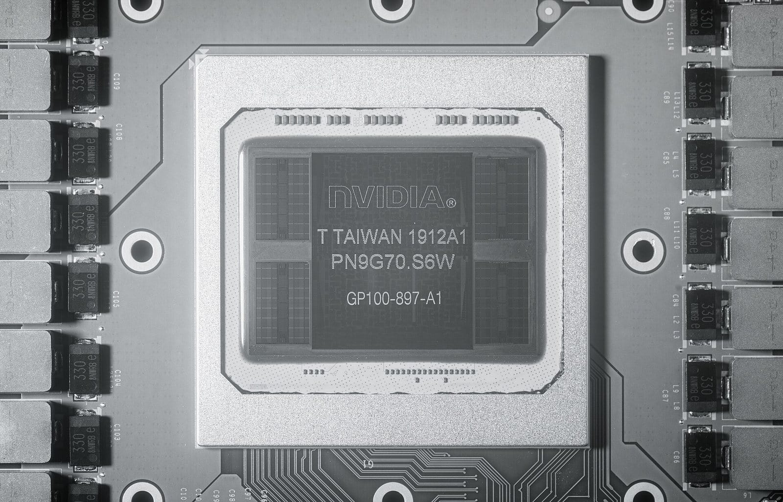 Infrared photo of an NVIDIA GP100 package: a large central die marked NVIDIA GP100 with two gridded rectangles on each side, surrounded by circuit-board components