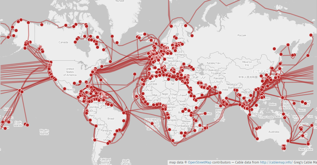A world map covered in red lines showing undersea cables connecting coastlines, densest across the Atlantic, the Mediterranean and around Asia
